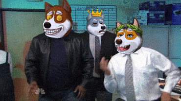 a man in a suit has a crown on his head and a dog mask on his head
