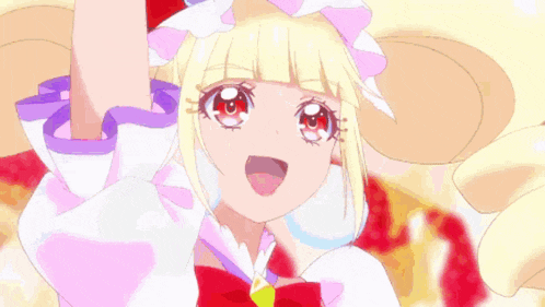 a girl with blonde hair and red eyes is wearing a pink dress and holding a sword .