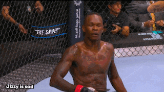 a man in a boxing ring with the words jizzy is sad below him
