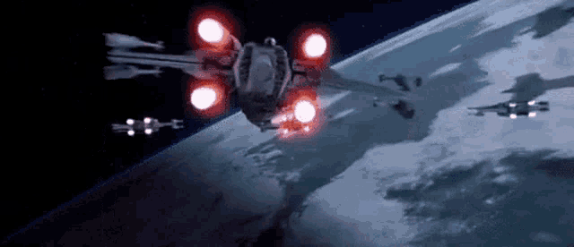 a fighter jet is flying over the earth in space .