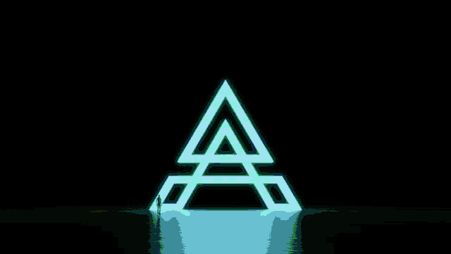 a person stands in front of a glowing letter a
