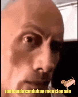 a close up of a bald man 's face with the words tonhaodosandubao menclonado in yellow