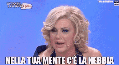a woman talking on a cell phone with nella tua mente c ' e la nebbia