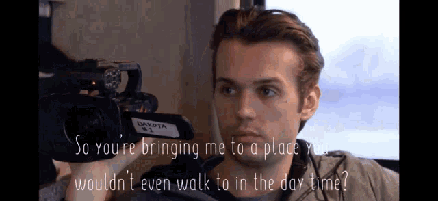 a man is holding a dakota camera and says so you 're bringing me to a place you