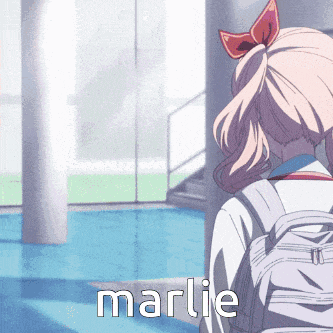 a girl with a backpack stands in front of a window with the name marlie written on it