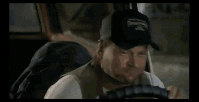a blurry picture of a man driving a car