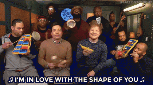 a group of men playing musical instruments with the words i 'm in love with the shape of you