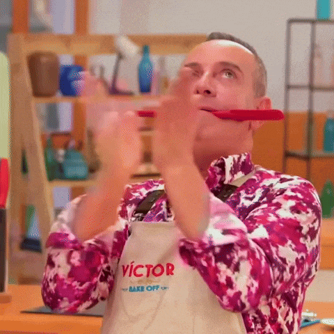 a man wearing an apron with victor on it