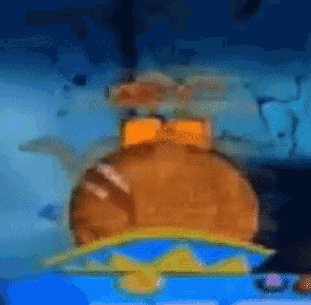 a hamburger with a crown on top of it is sitting on top of a blue table .