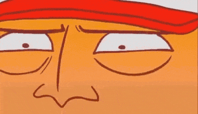 a close up of a cartoon face with a red hat on making a funny face .