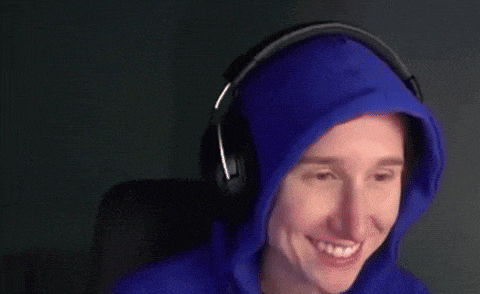 a woman wearing a blue hoodie and headphones