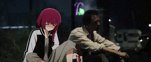 a man and a girl are sitting next to each other on the ground . the girl is holding a bottle of wine .