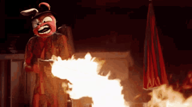 a clown in a bunny mask is holding a gun
