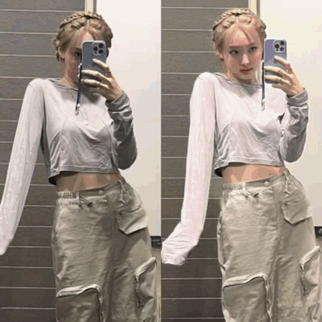 a woman taking a picture of herself in a mirror with her phone