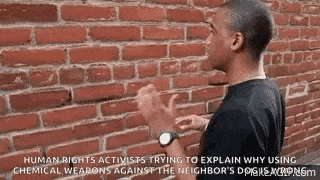 a man is standing in front of a brick wall and talking to someone .