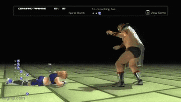 a video game shows a wrestler kicking another wrestler on the floor