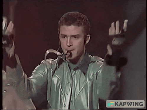 a group of men are dancing on a stage with a sign that says kapwing on the bottom