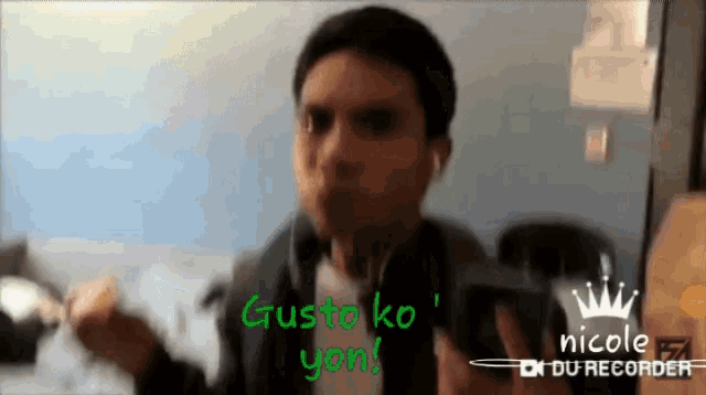 a man wearing headphones says gusto ko yon in green