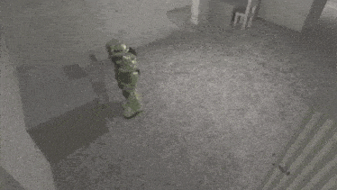 a robot with a gun is standing next to a green robot