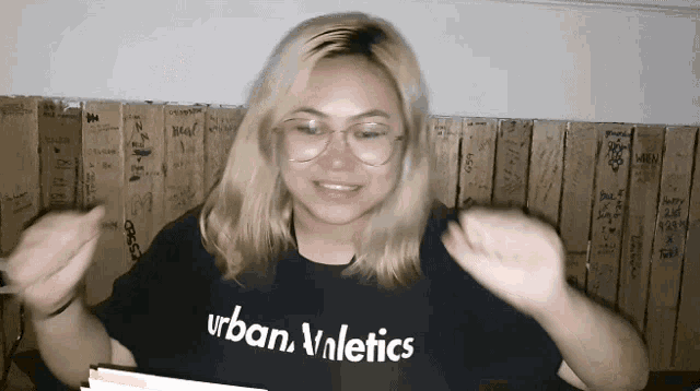 a woman wearing a black urban valetics shirt