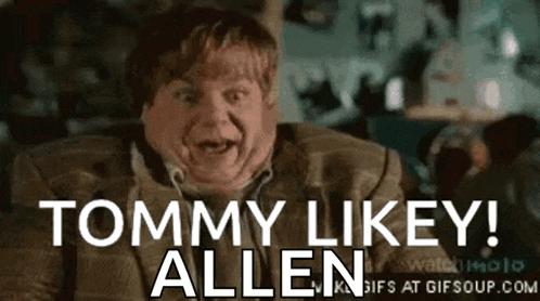 a man in a suit is making a funny face and saying tommy likey allen