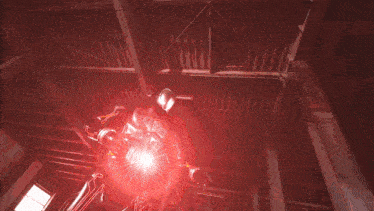 a bright red light is shining through the ceiling of a building