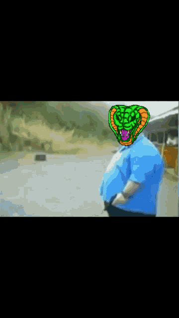 a man with a green snake on his head holds a gun