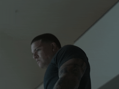 a man in a black shirt with his mouth open