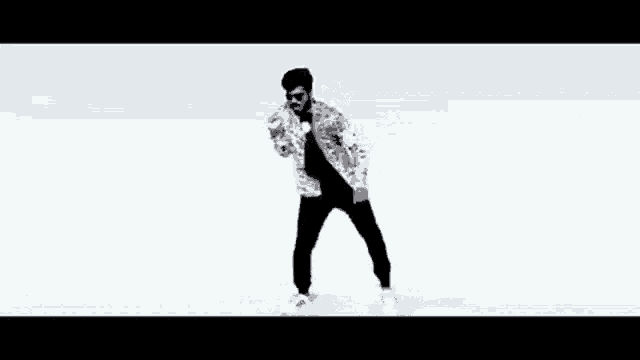 a man is dancing on a white background while wearing sunglasses .