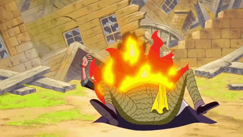 a man laying on the ground with a fire coming out of his back