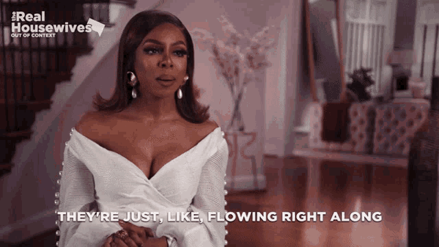 a woman in a white dress says they are just like flowing right along
