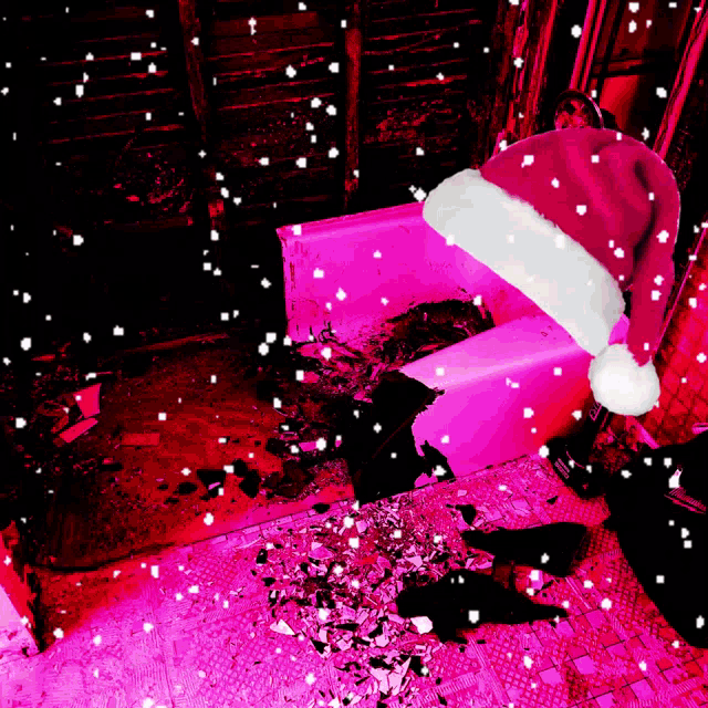 a person wearing a santa hat is laying on the floor