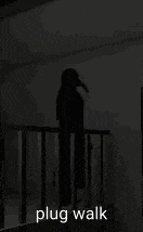 a silhouette of a person standing on a balcony with the words plug walk written on the bottom .
