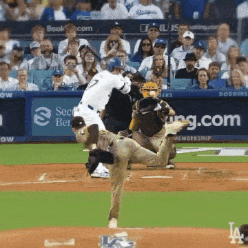 a dodgers baseball game is being played in front of a crowd of fans