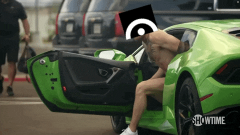 a shirtless man is getting into a green showtime car