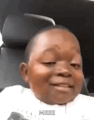 a baby is making a funny face in a car seat .