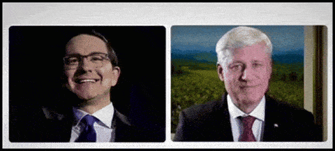a man in a suit and tie smiles next to another man in a suit and tie .