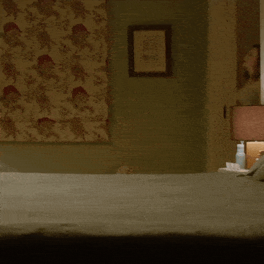 a man and a woman are laying on a bed