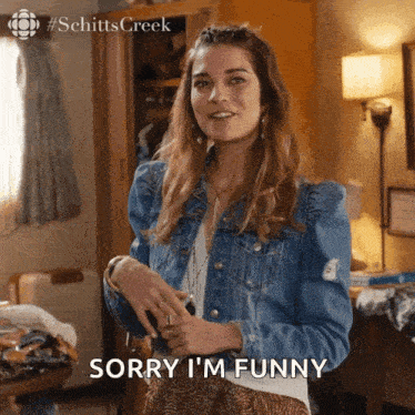 a woman says sorry i 'm funny in front of a closet