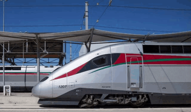 a silver train with the number 1207 on the front