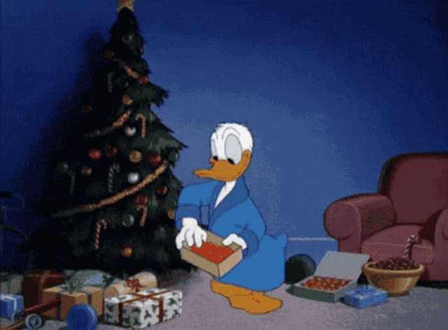 a cartoon of donald duck sitting in front of a christmas tree with presents