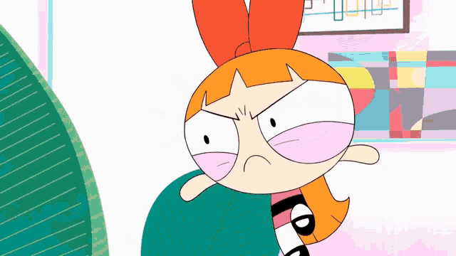 a cartoon character with an angry look on her face is wearing a sweater that says ' blossom ' on it