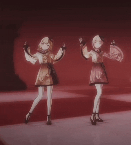 two anime girls are standing next to each other on a stage