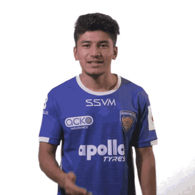 a young man wearing a blue apollo tyres shirt