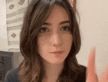 a close up of a woman 's face with a blurred background