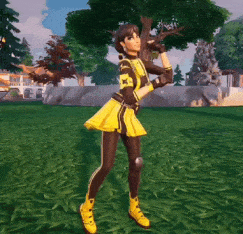 a girl in a yellow and black outfit is standing in the grass holding a tree branch .