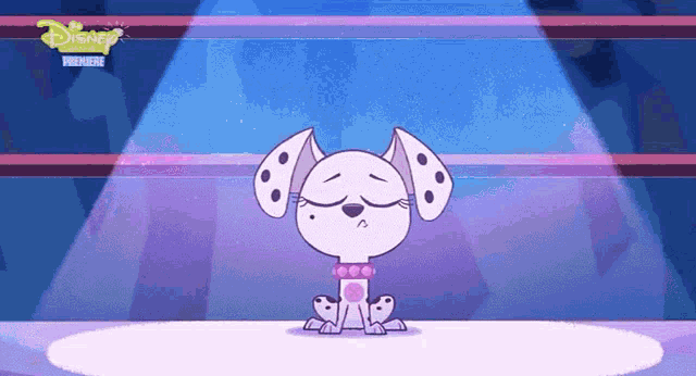 a cartoon dalmatian dog is sitting on a stage in front of a spotlight with disney written on the bottom
