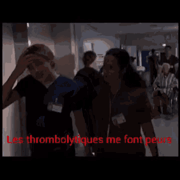a group of people walking down a hallway with the words les thrombolytiques me font peur