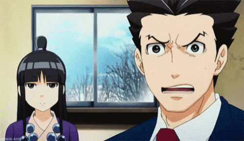 a man and a woman are standing next to each other and the man has a surprised look on his face