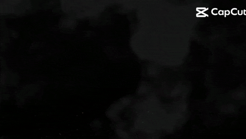 a close up of the word guys on a dark background